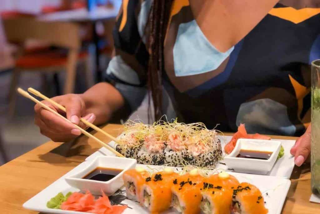 Woman eating Sushi