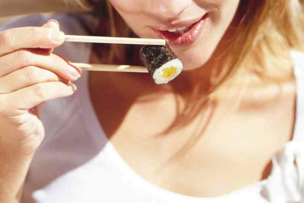 Eating Japanese sushi