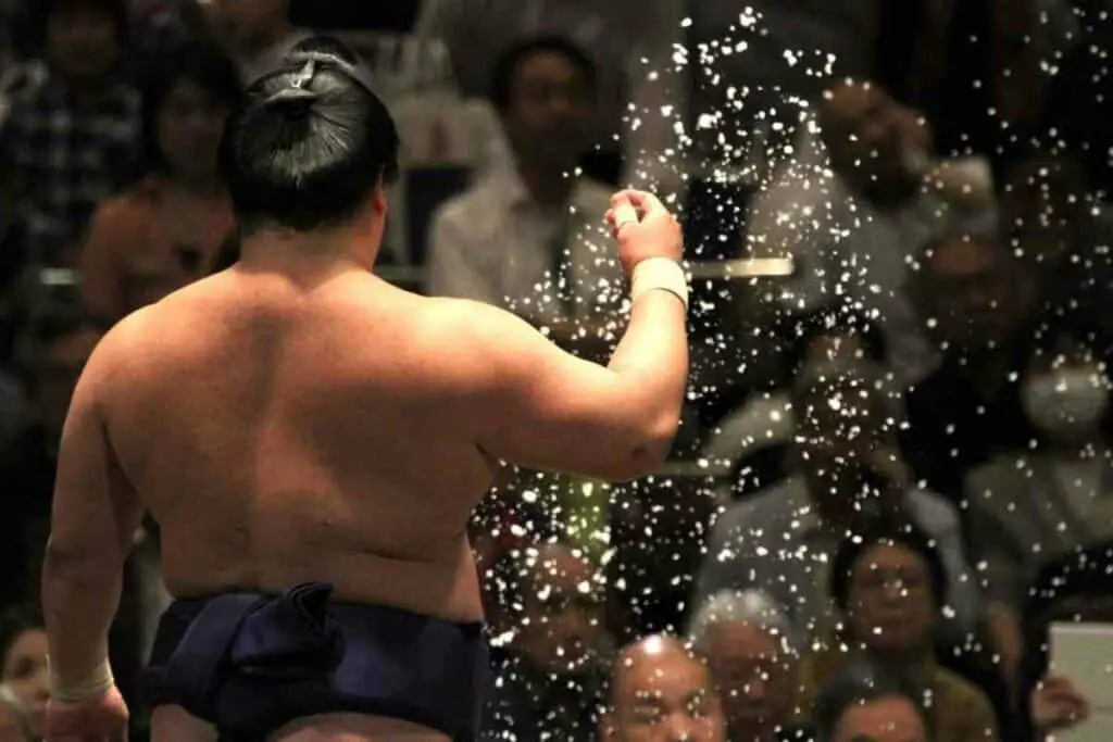 Sumo wrestler throwing salt