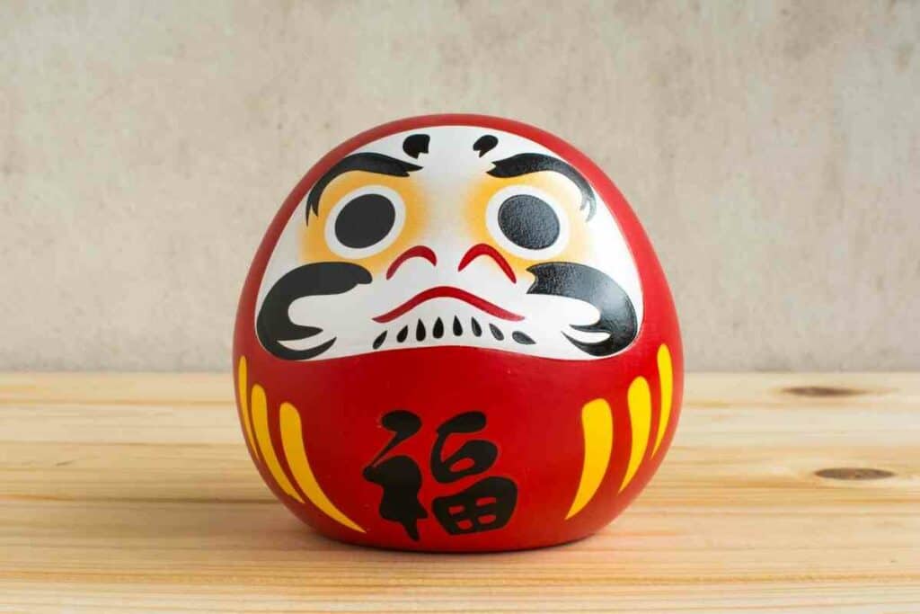 How do you use daruma doll explained