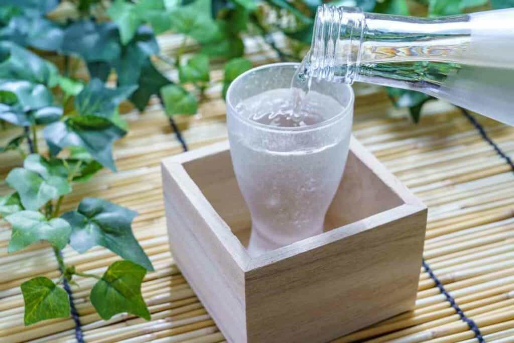 Drinking sake from masu wooden box