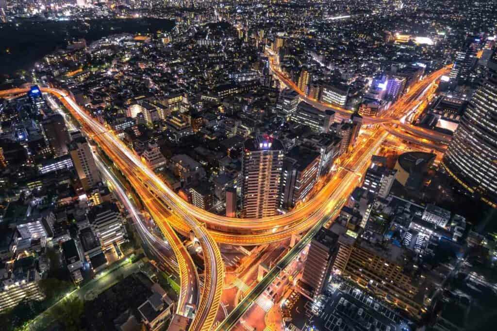 Tourists Traveling in Tokyo At night